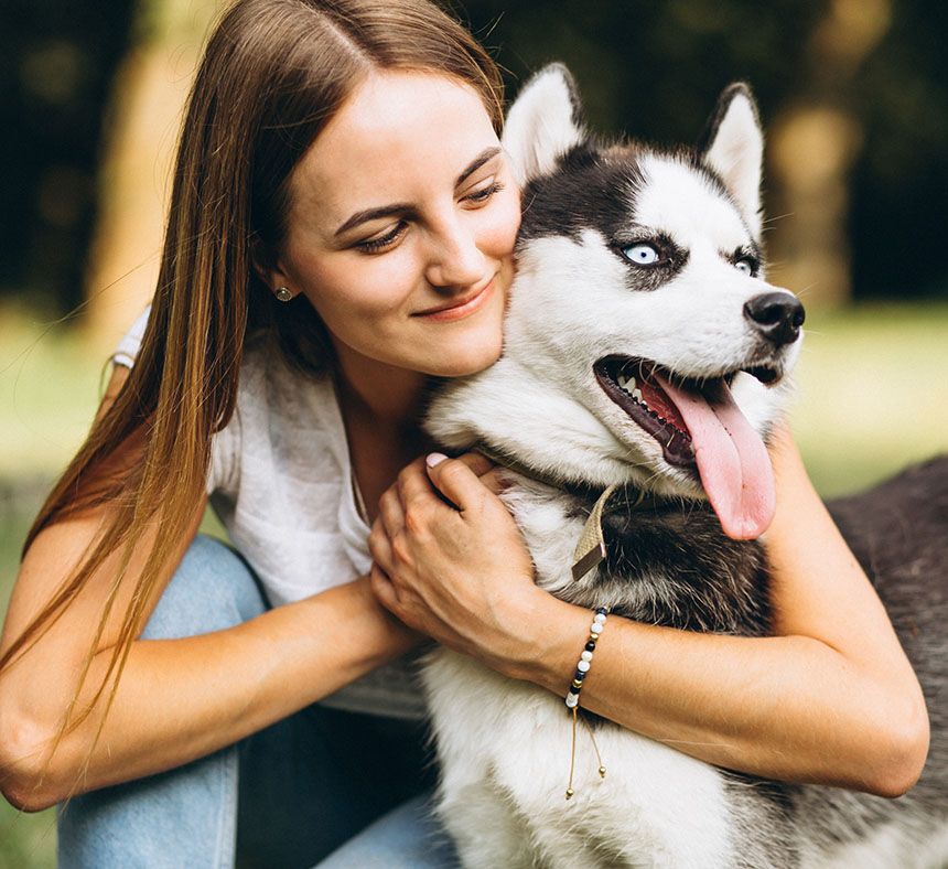 girl with her husky dog at park